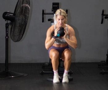 Juggernaut Fitness Woman doing Weighted Squats